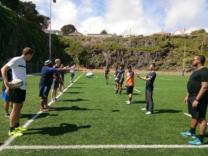 International students have a ball learning to play rugby (2)