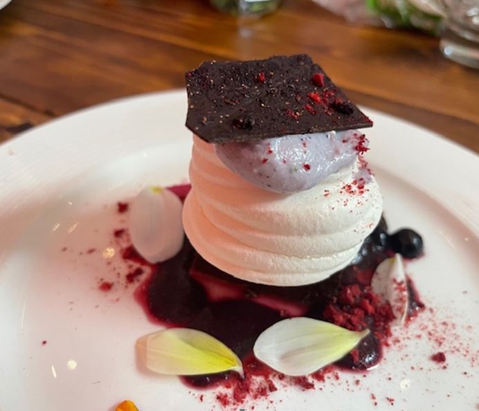 Seddon 64’s Chocolate Nemesis with meringue case filled with Clevedon Buffalo ricotta blueberry mousse.