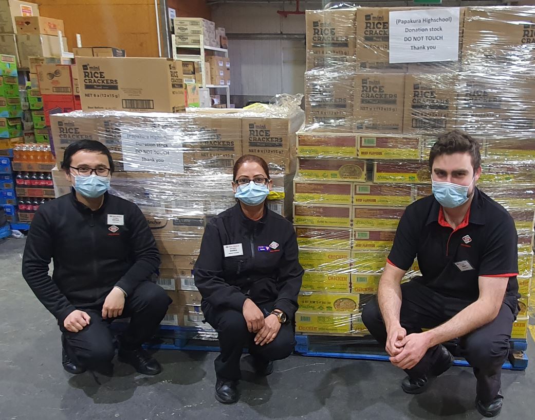 New World Southmall staff Arthur, Sarika and James are all busy preparing donations for the vaccination drive.