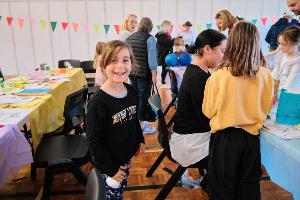A child at a commumnity gathering. 