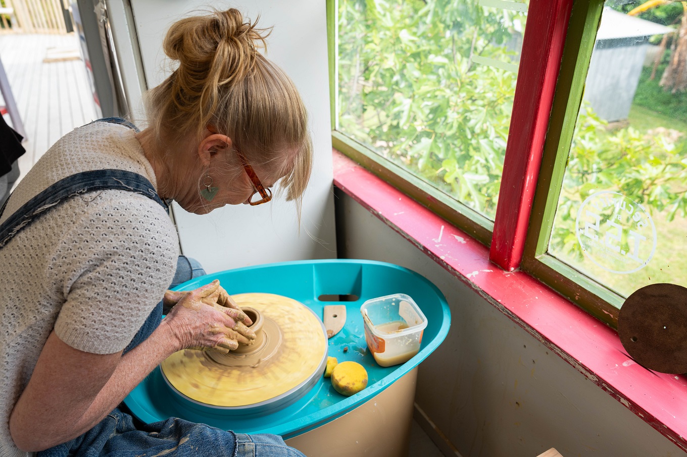 Artist working on claywork.