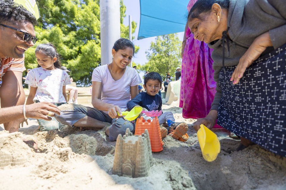 Locals enjoying sand play at Olympic Park playground.