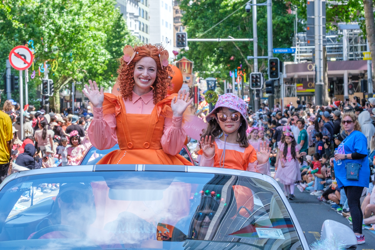 Lady and child in orange.