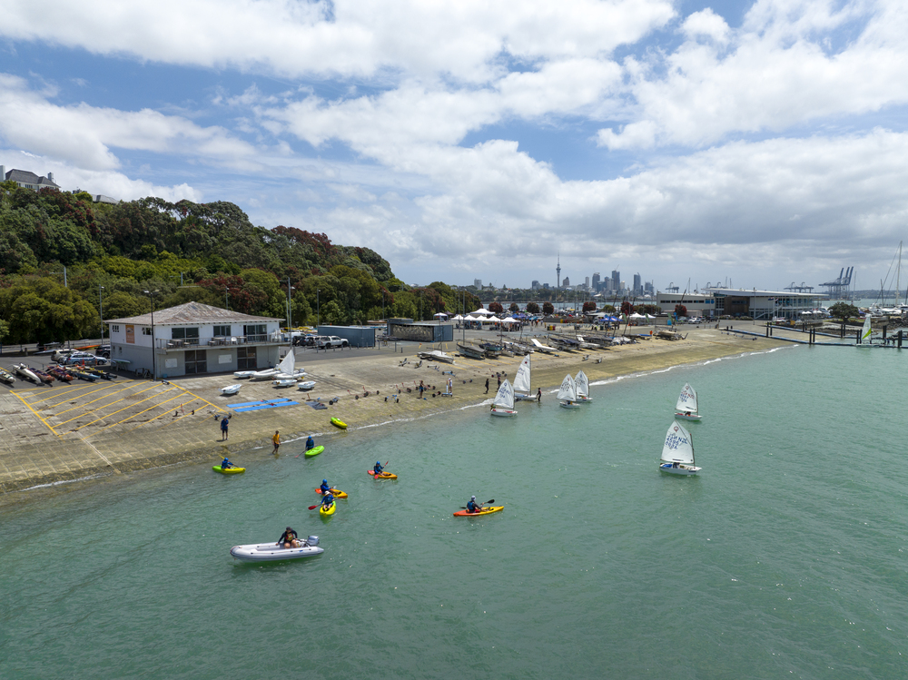 Boats sailing around the local boathouse. 