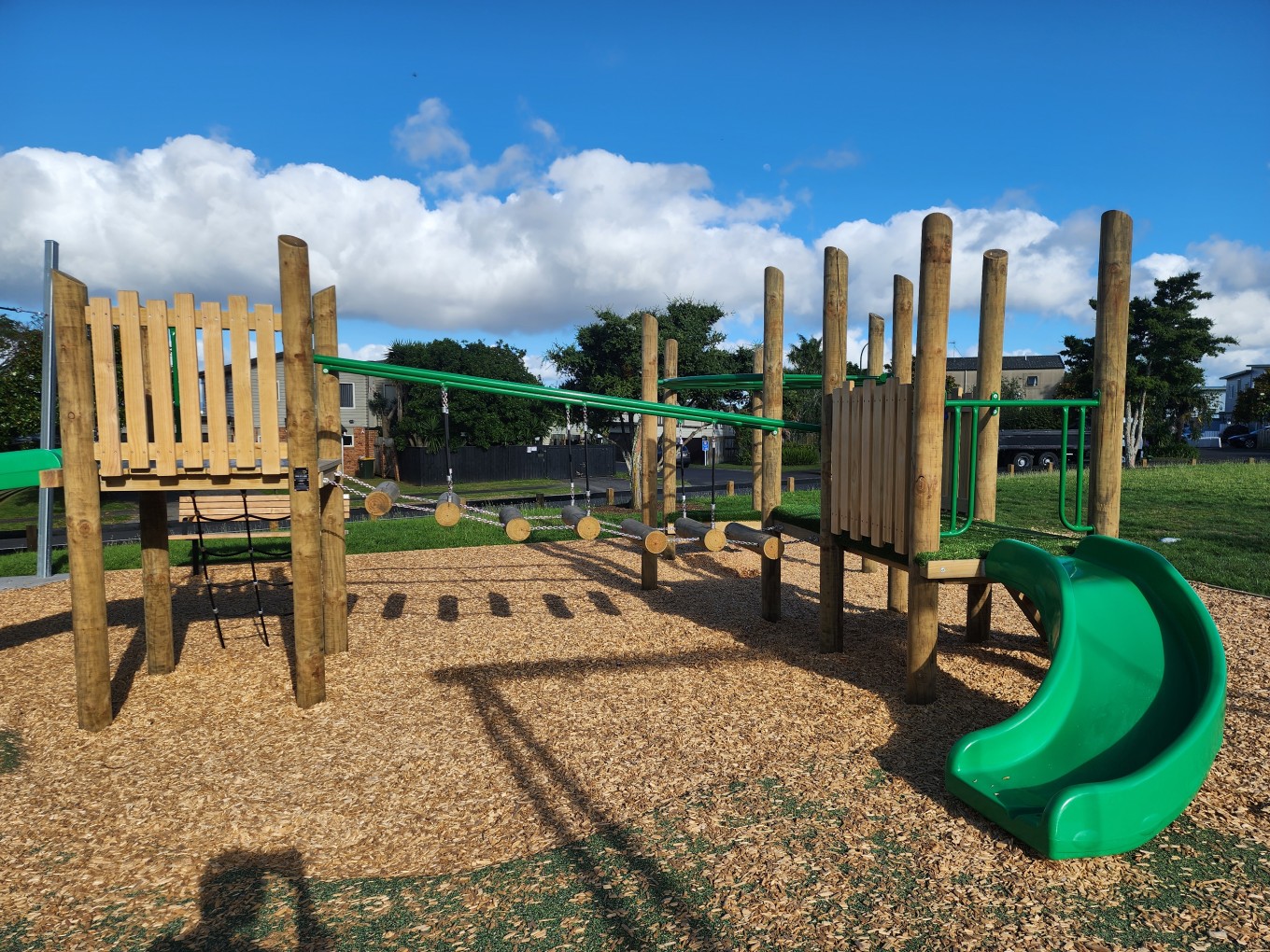 A local playground and slide on bark. 