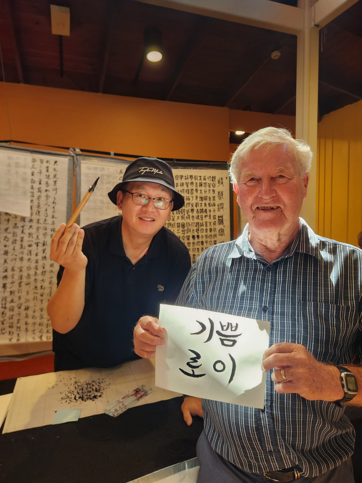 People learning how to do traditonal Korean writing script.