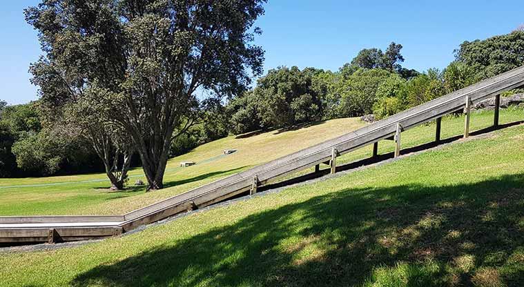 Picture of part of a long metal chute-style slide at Waikōwhai Park, Hillsborough