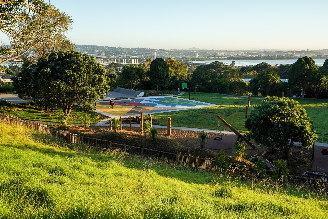 The whānau ātea at Te Pane o Mataoho / Te Ara Pueru / Māngere Mountain includes a māra hūpara (traditional Māori playground) and a basketball court.