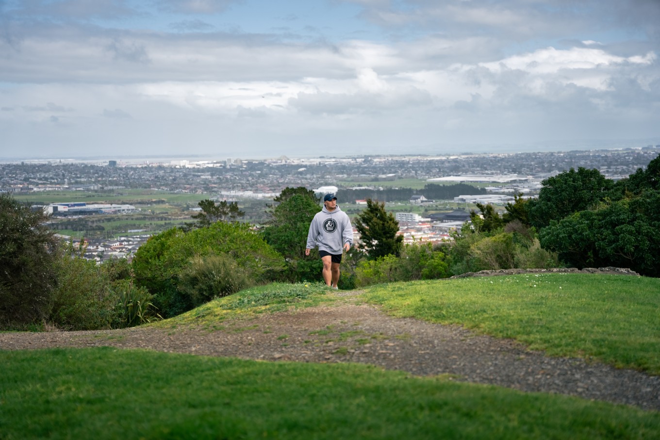 A guy walking in nature.