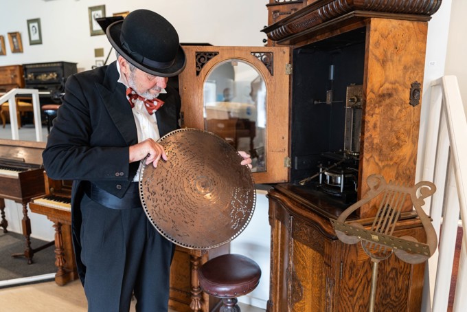 A elder gentleman with a musical instrument