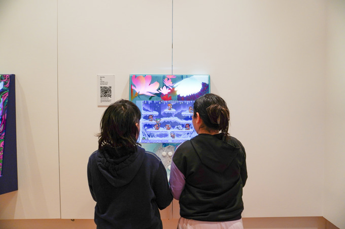 Children on a arcade machine