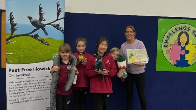 Teacher and students posing for photo