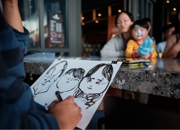 A sketch artist drawing a picture of a family. 