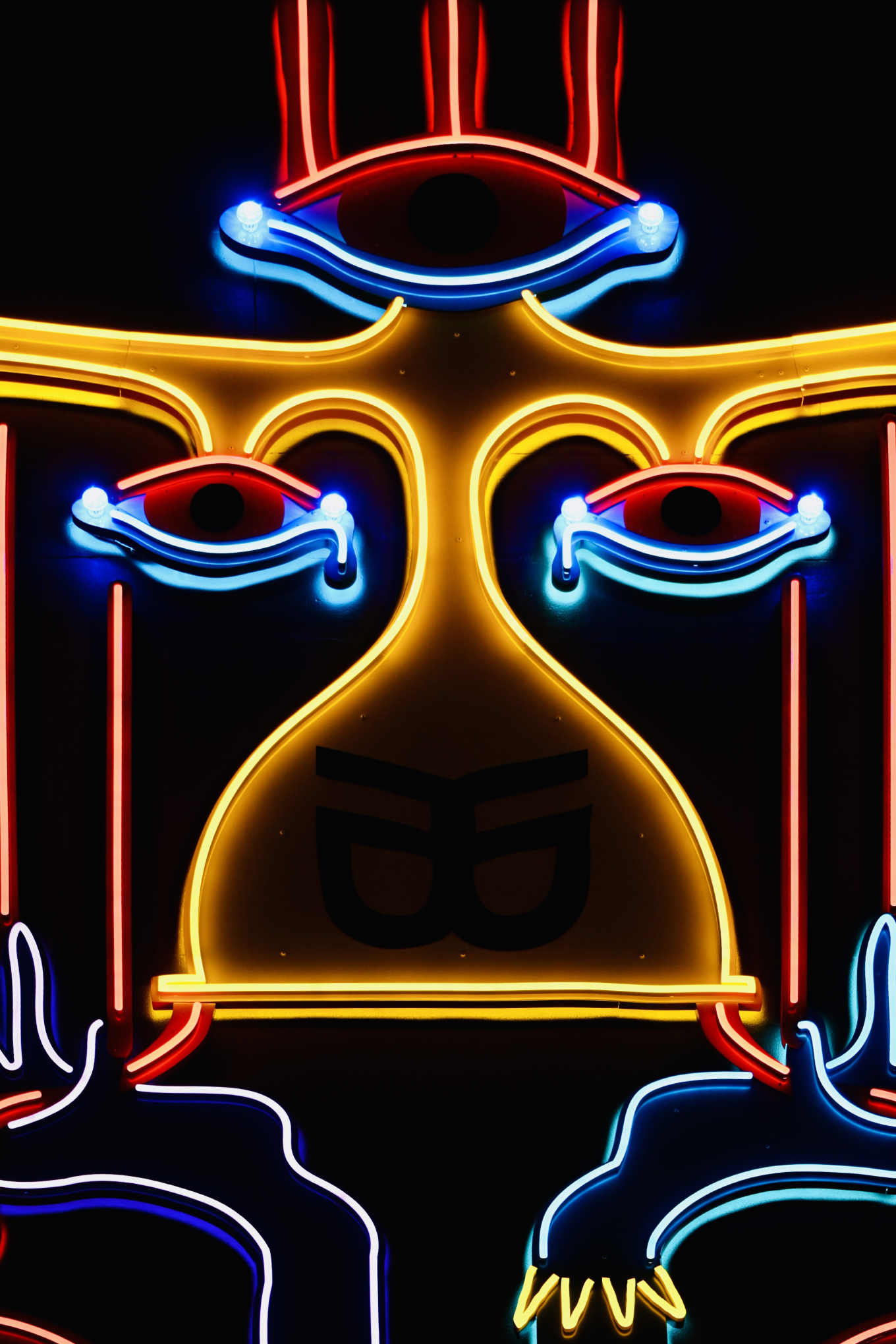 A colourful neon lit street mural. 