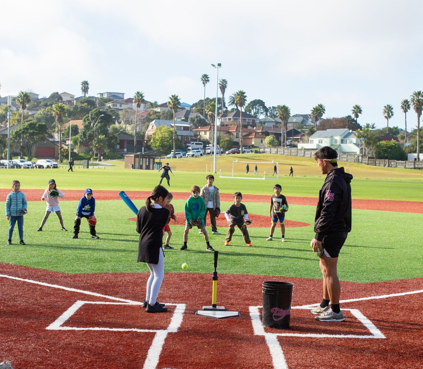 Kids playing softball. 
