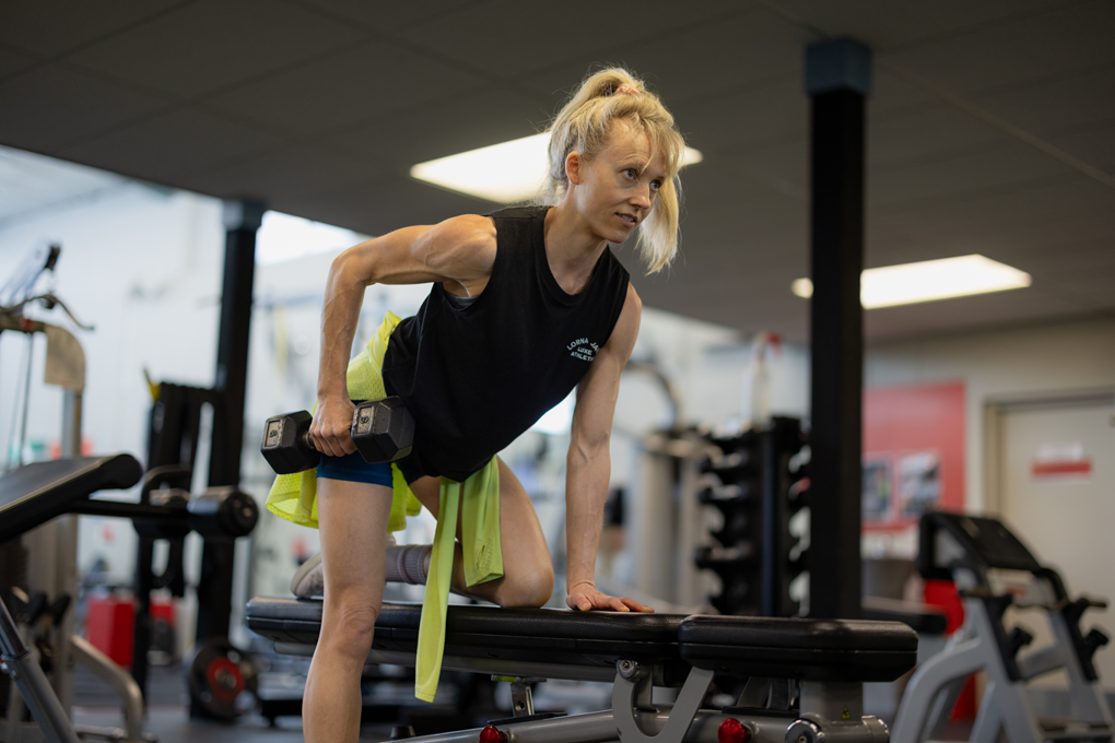 A Lady Exercising At A Gym