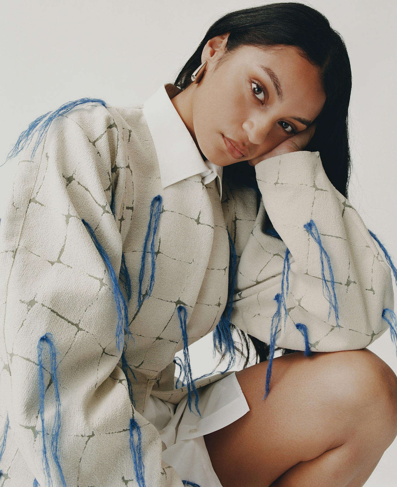 A women in a white fashionable shirt. 