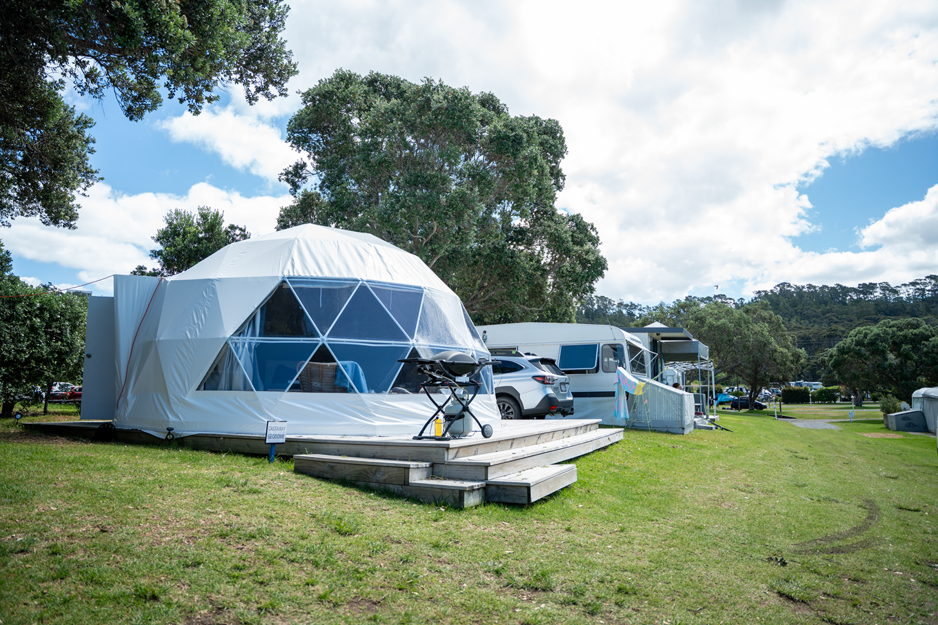 A collection of geo domes on a campsite.