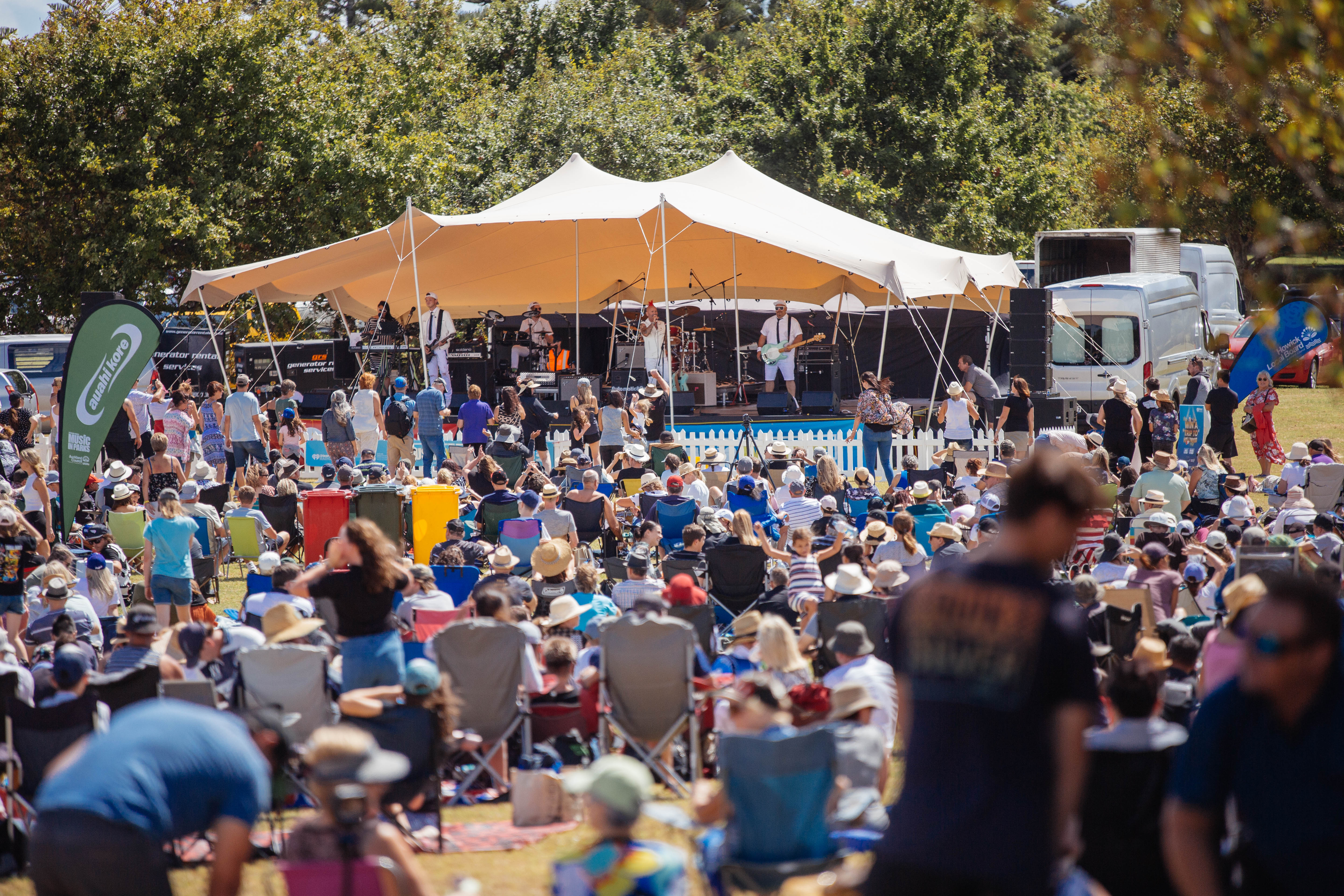 A crowd watches a band play a 'Music in Parks' Lloyd Elsmore Park, Pakuranga