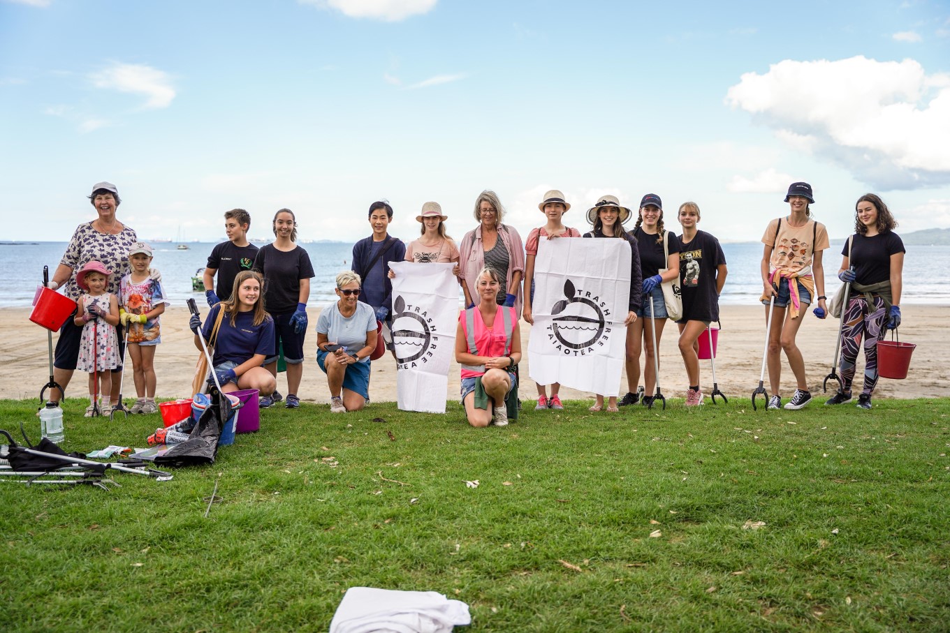 Emma Wingrove (centre in pink high-vis vest) started North Shore group Clean Up Crew in 2014 because she couldn’t stand seeing so much rubbish on the beach and wanted to do something about it.