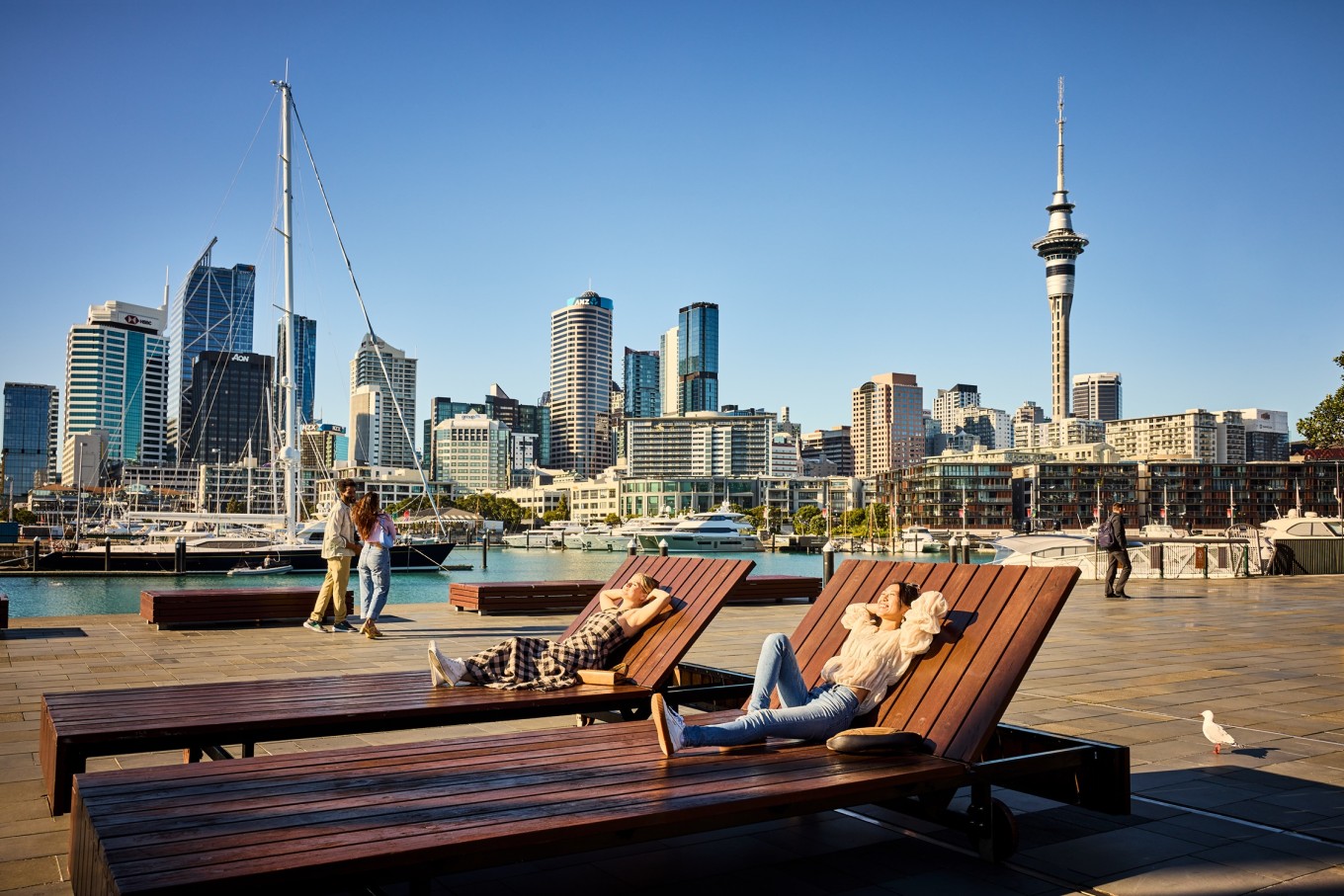 Two people enjoying sunshine in Karanga Plaza.