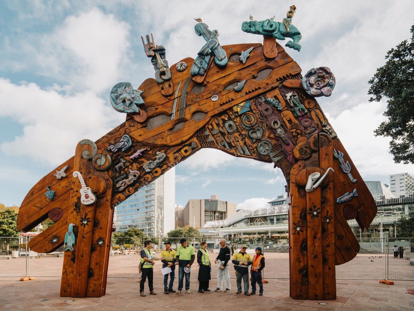 People by a public artwork.