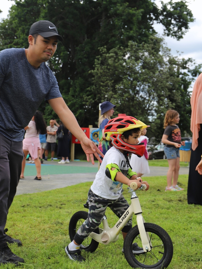 A kid playing on a bike