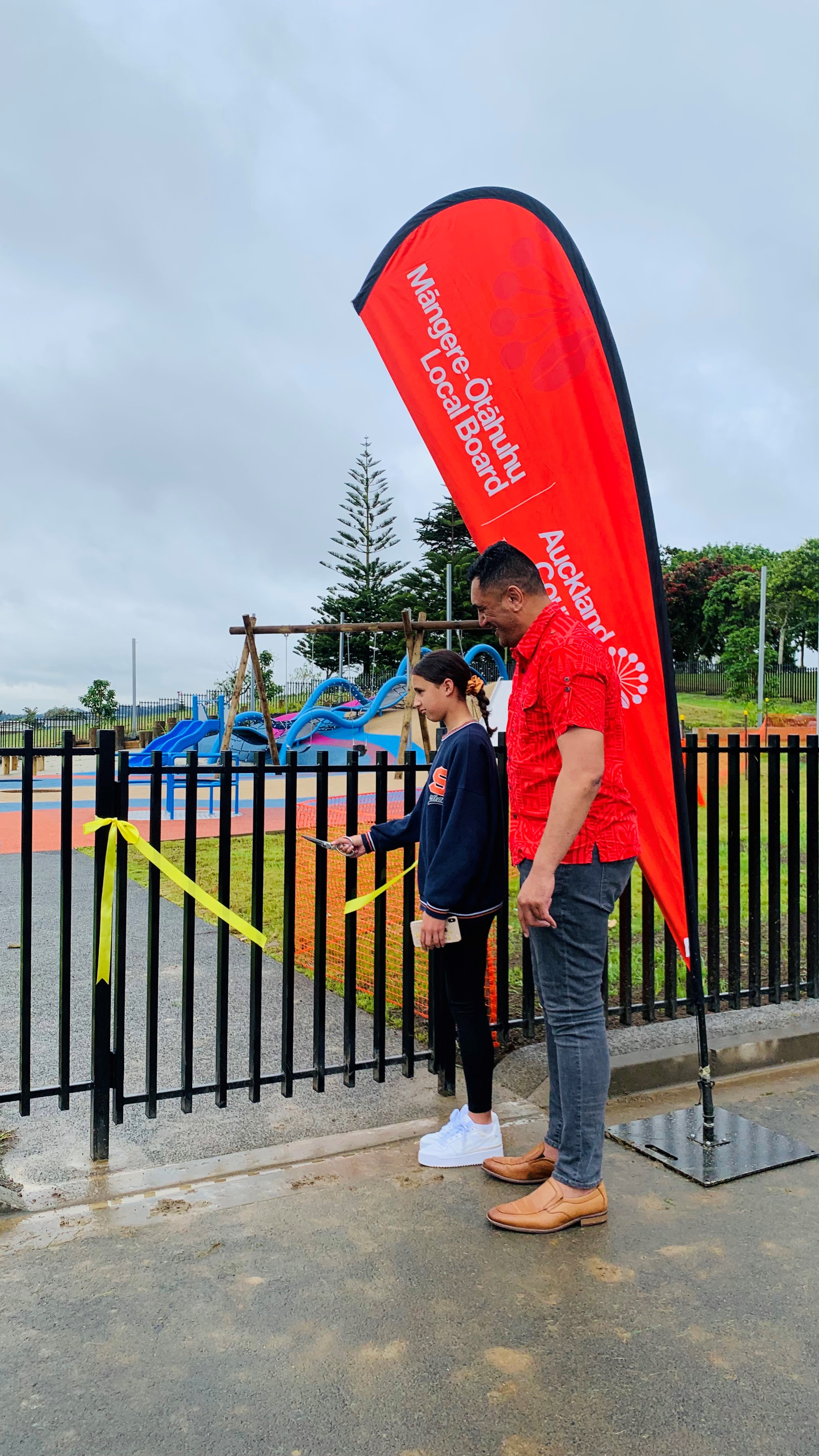 Anja Teaukura and Māngere-Ōtāhuhu Local Board Chair, Tauau'u Nick Bakulich cuts ribbon to open Māngere Centre Park playground