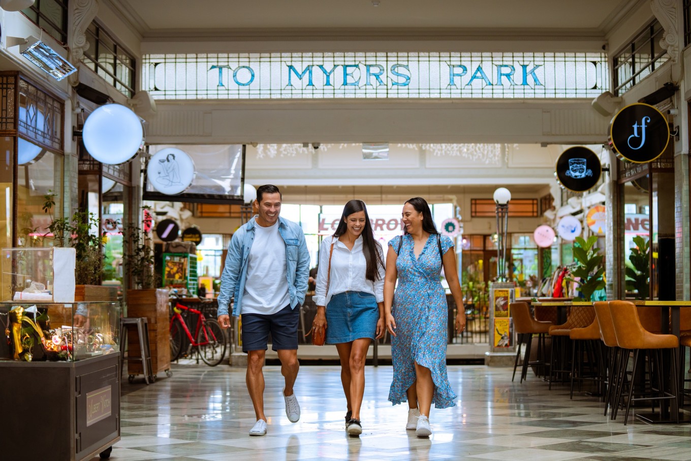 A group of people walking through St Kevin's Arcade. 
