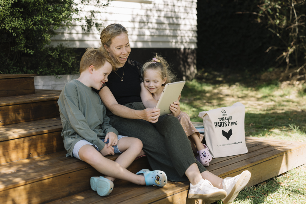 A family on the porch reading a ebook