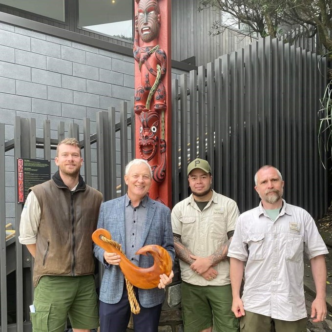 The opening celebration of Karekare Surf Lifesaving Club, Mayor Phil Goff with Auckland Council Regional Park Rangers (L-R) Theo Ashton, Josh Grigg and Simon Burton.