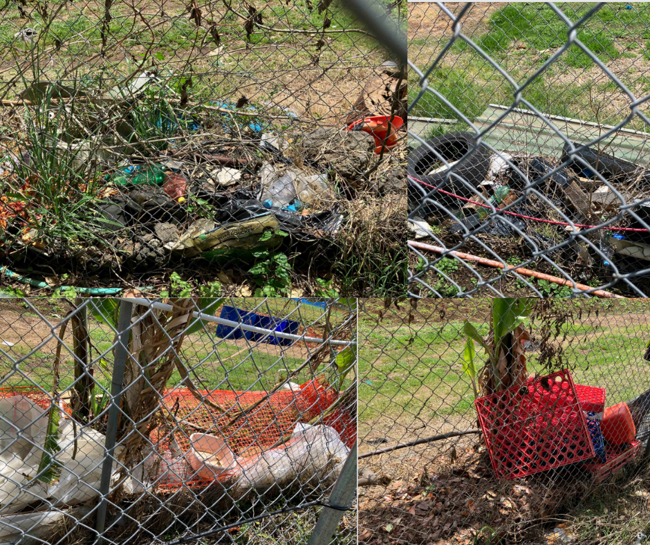 Large piles of rubbish illegally dumped at the local community garden.