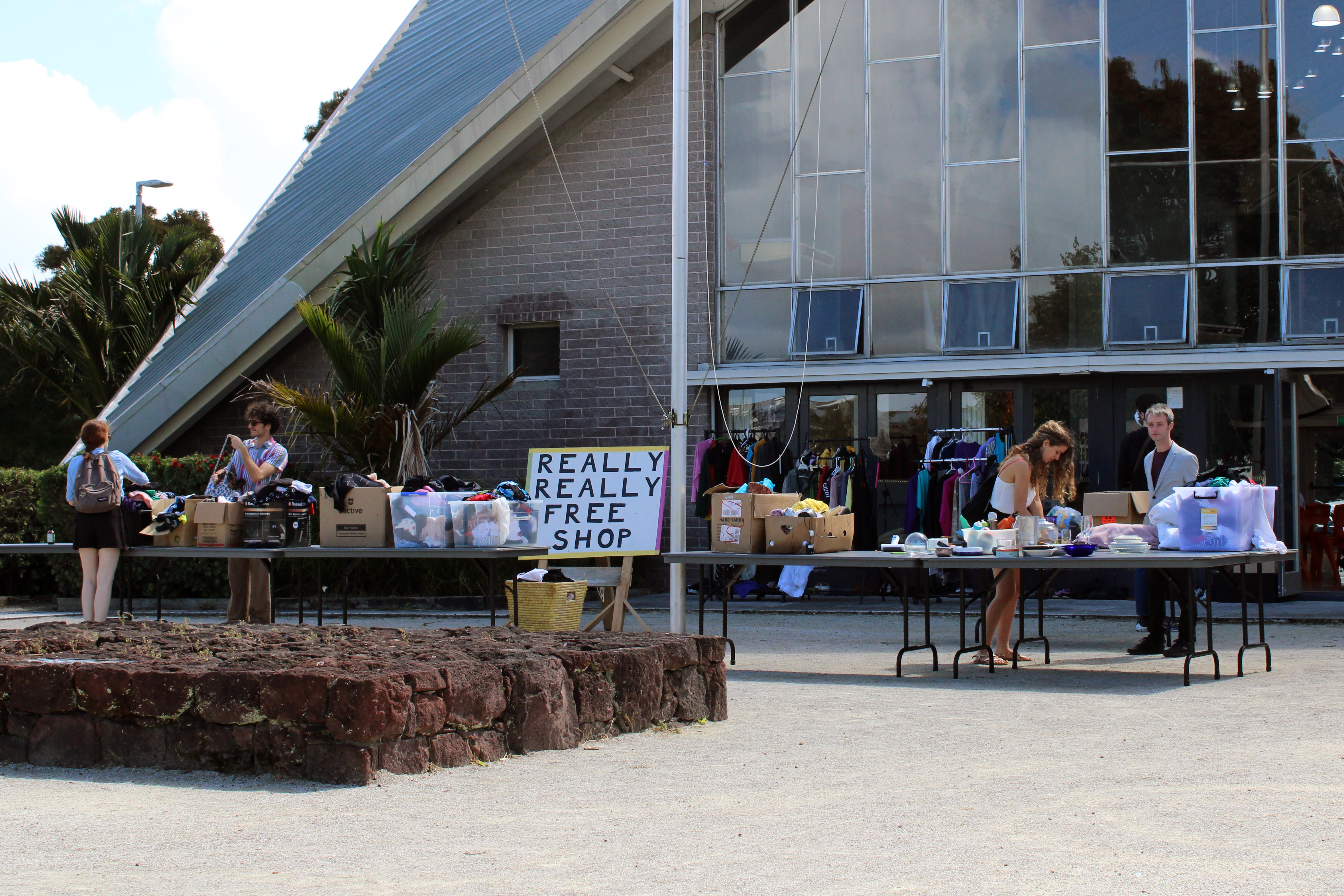 Used goods displayed on trestle tables to be given away to a good home