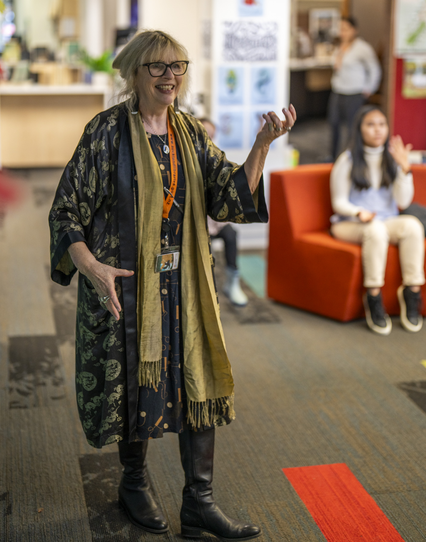 A lady guiding a local singalong session.