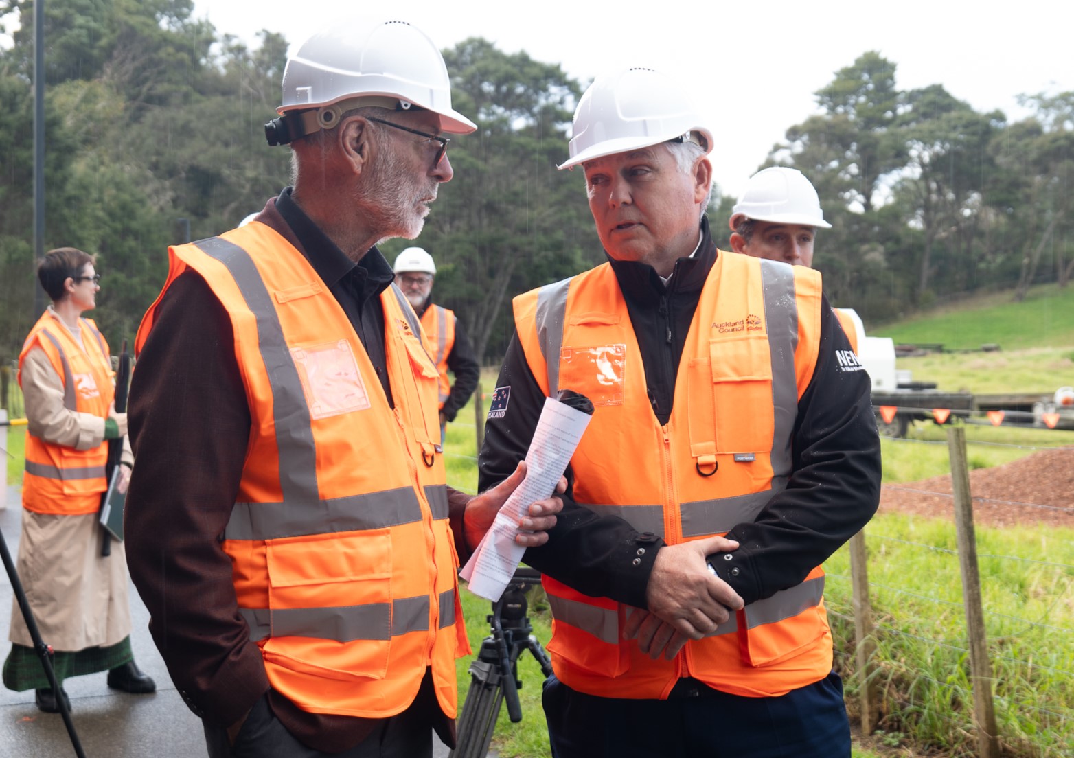 Mayor Wayne Brown on site in a orange vest. 