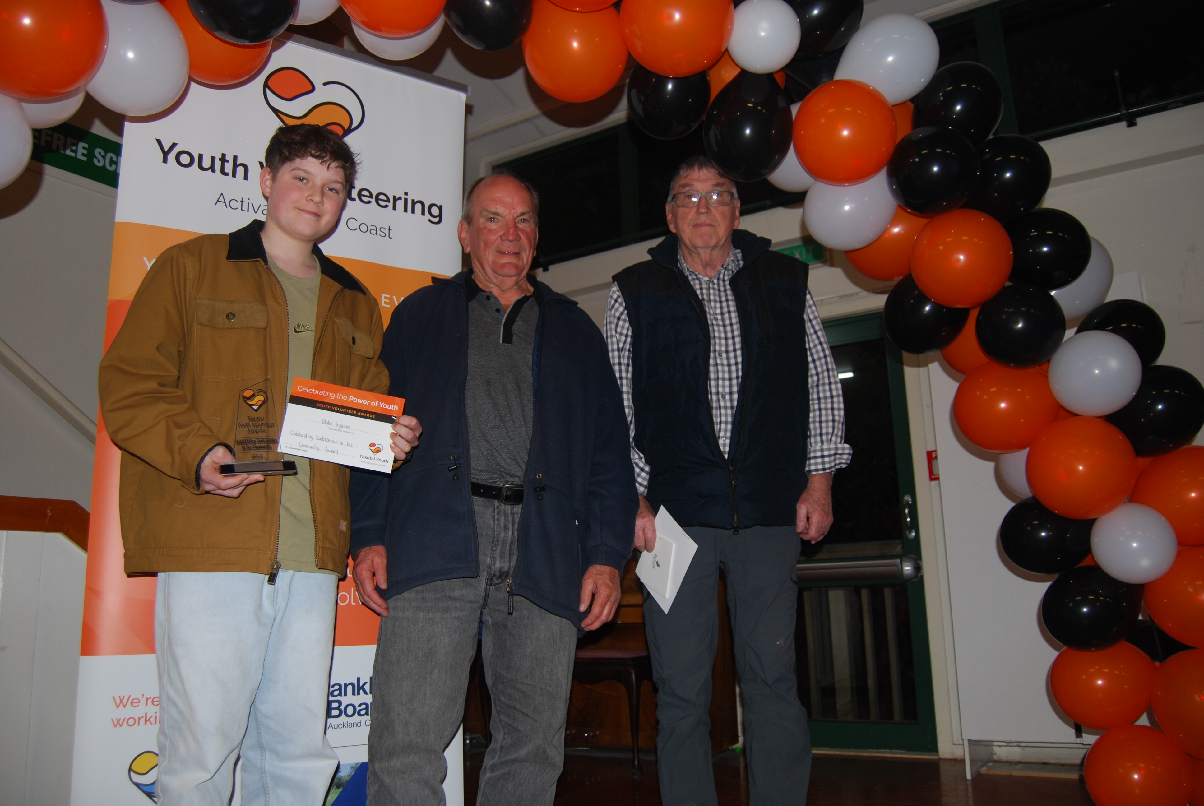 Blake Ingram with Pohutukawa Coast Rotary Club members.