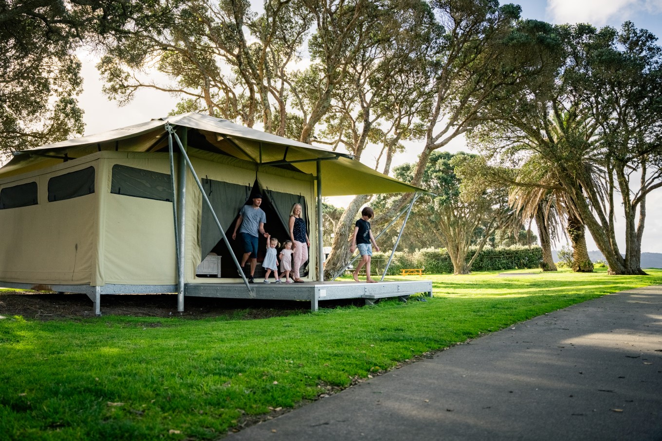 The deluxe eco-structure glamping tent at Ōrewa Beach Holiday Park has the Pacific Ocean outside its front door.