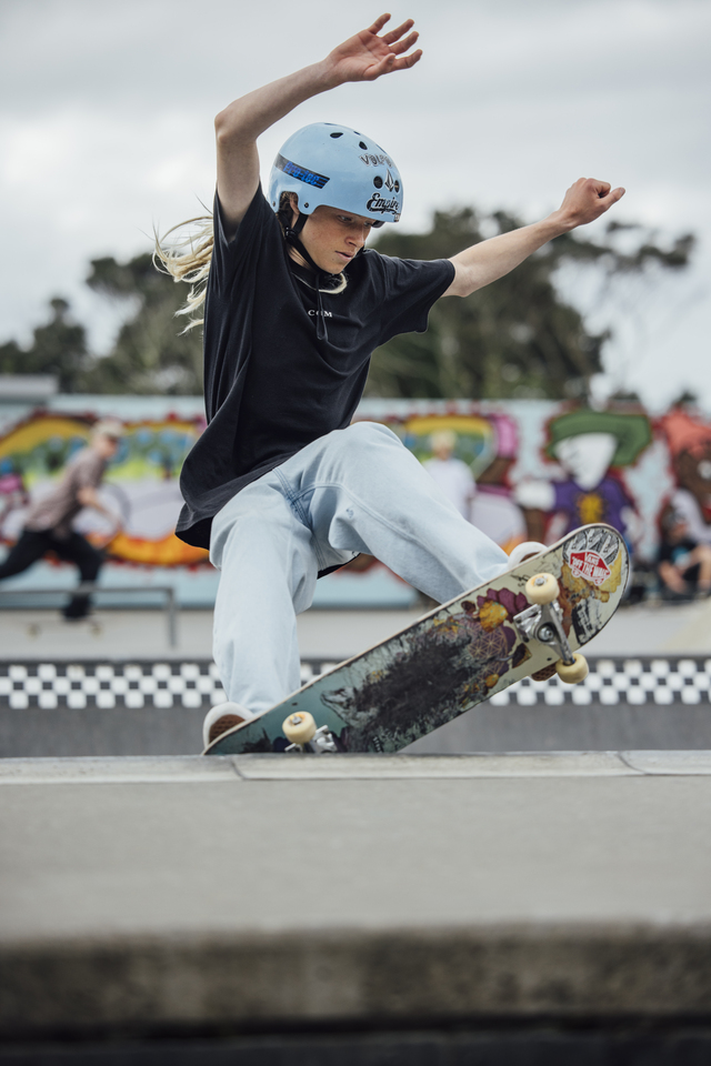 A person skateboarding on a ramp. 