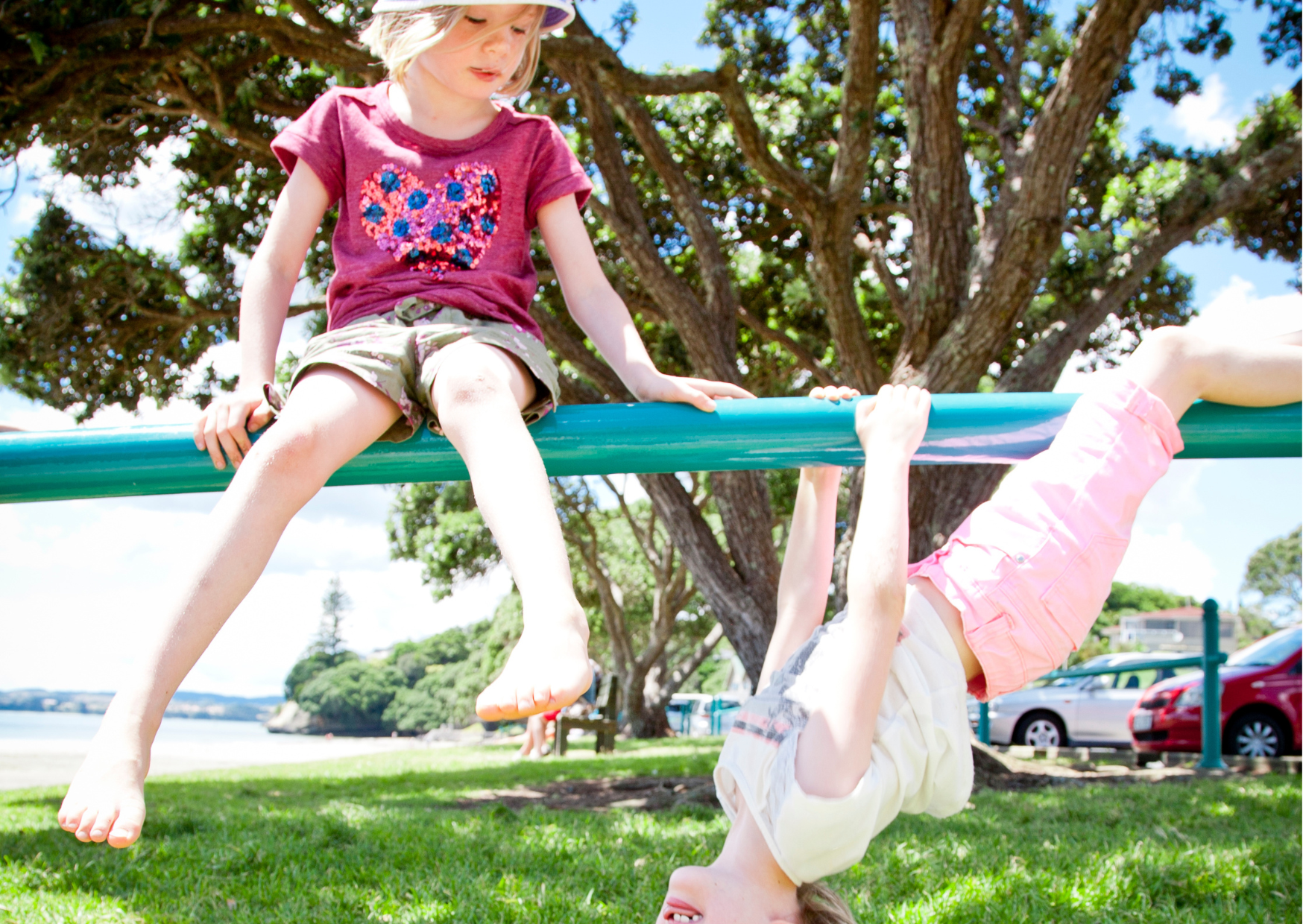 Two children on swinging bars.