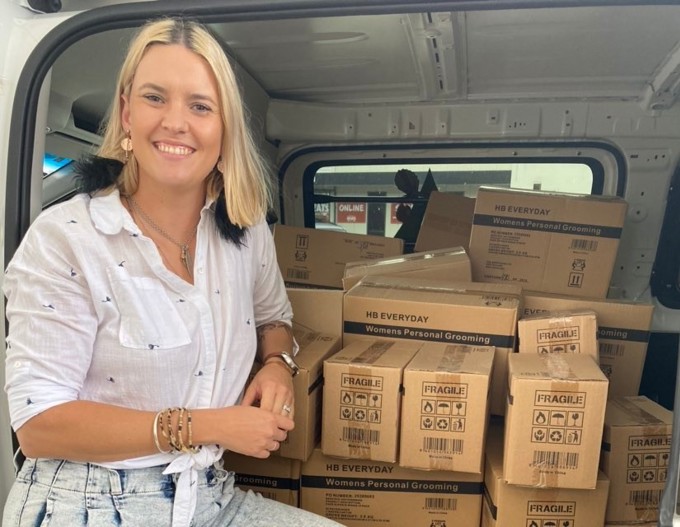 Photo Of Dani And Boxes Of Pads (1)