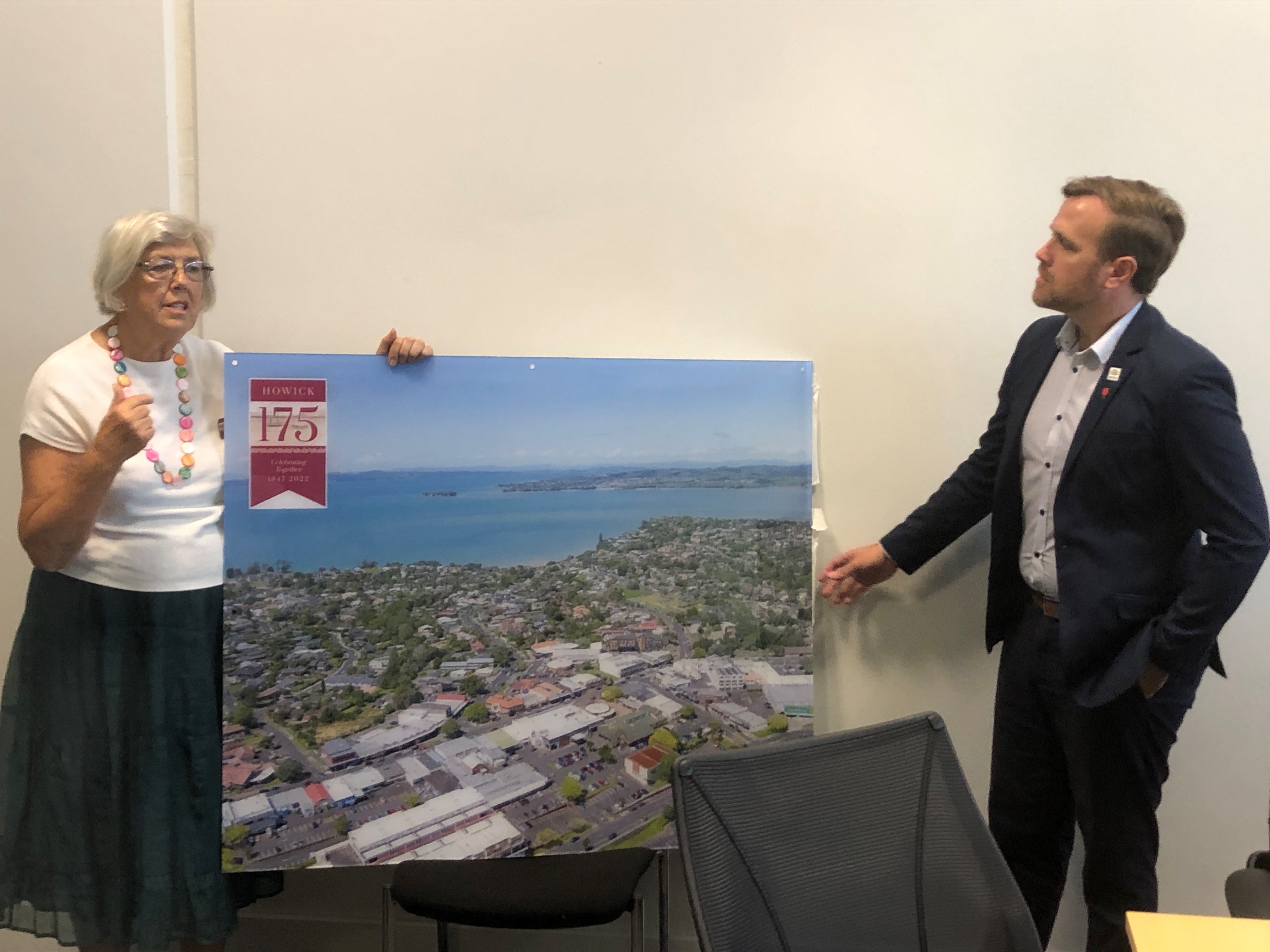 Trust volunteer Marin Burgess (holding picture) with Howick Local Board Chair, Damian Light.