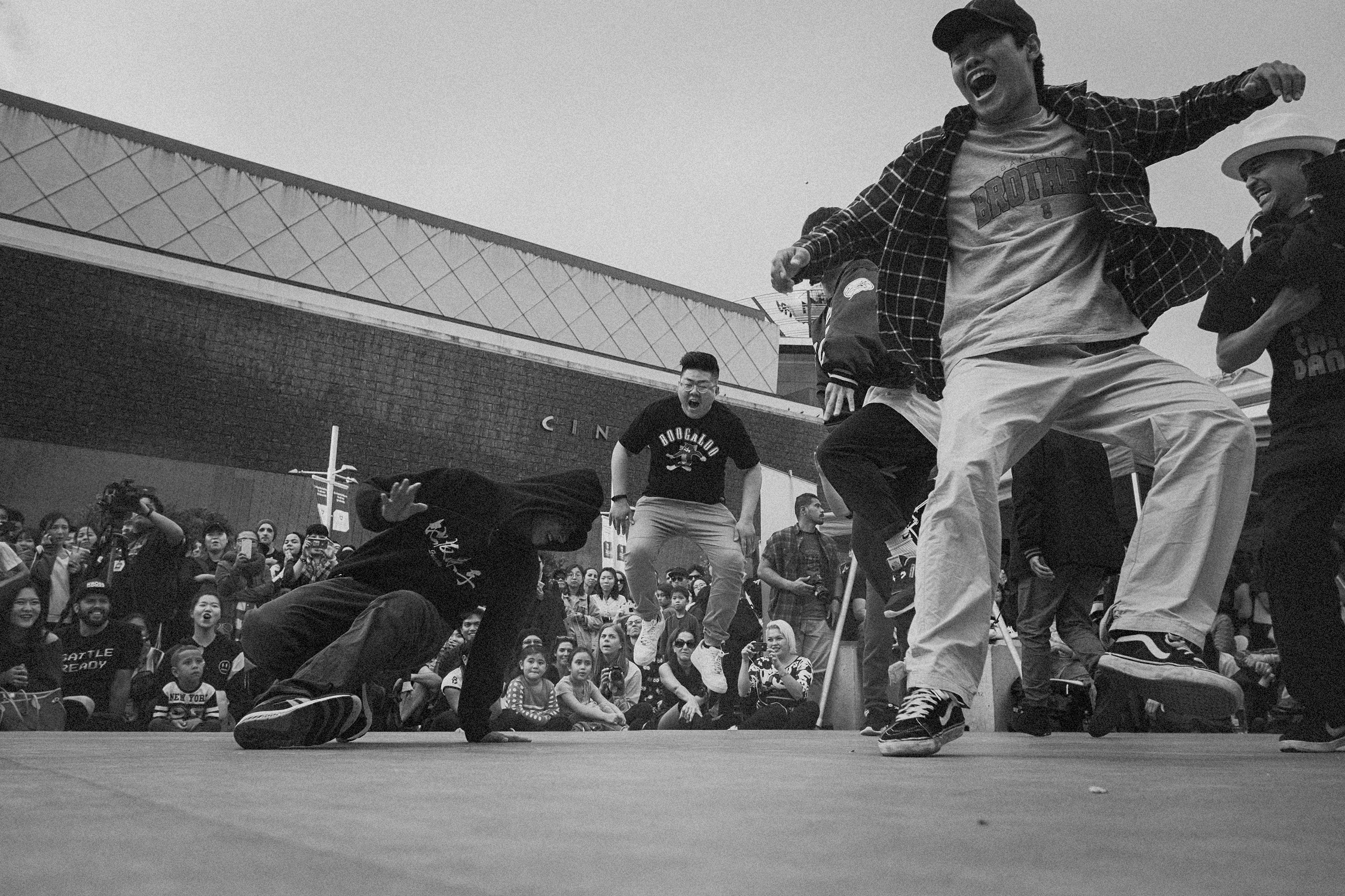 Black and dance photo of breakdancers.