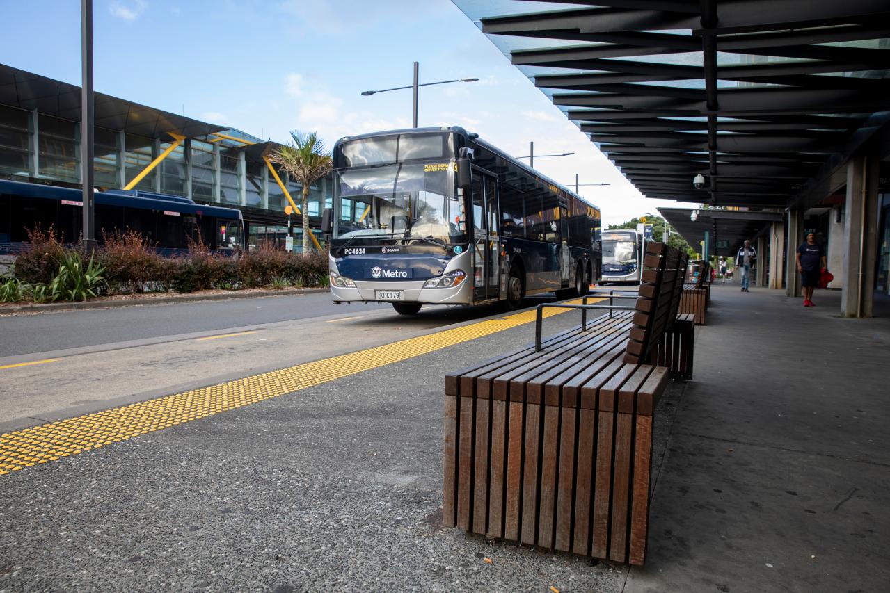 A bus parked outside a transport station.