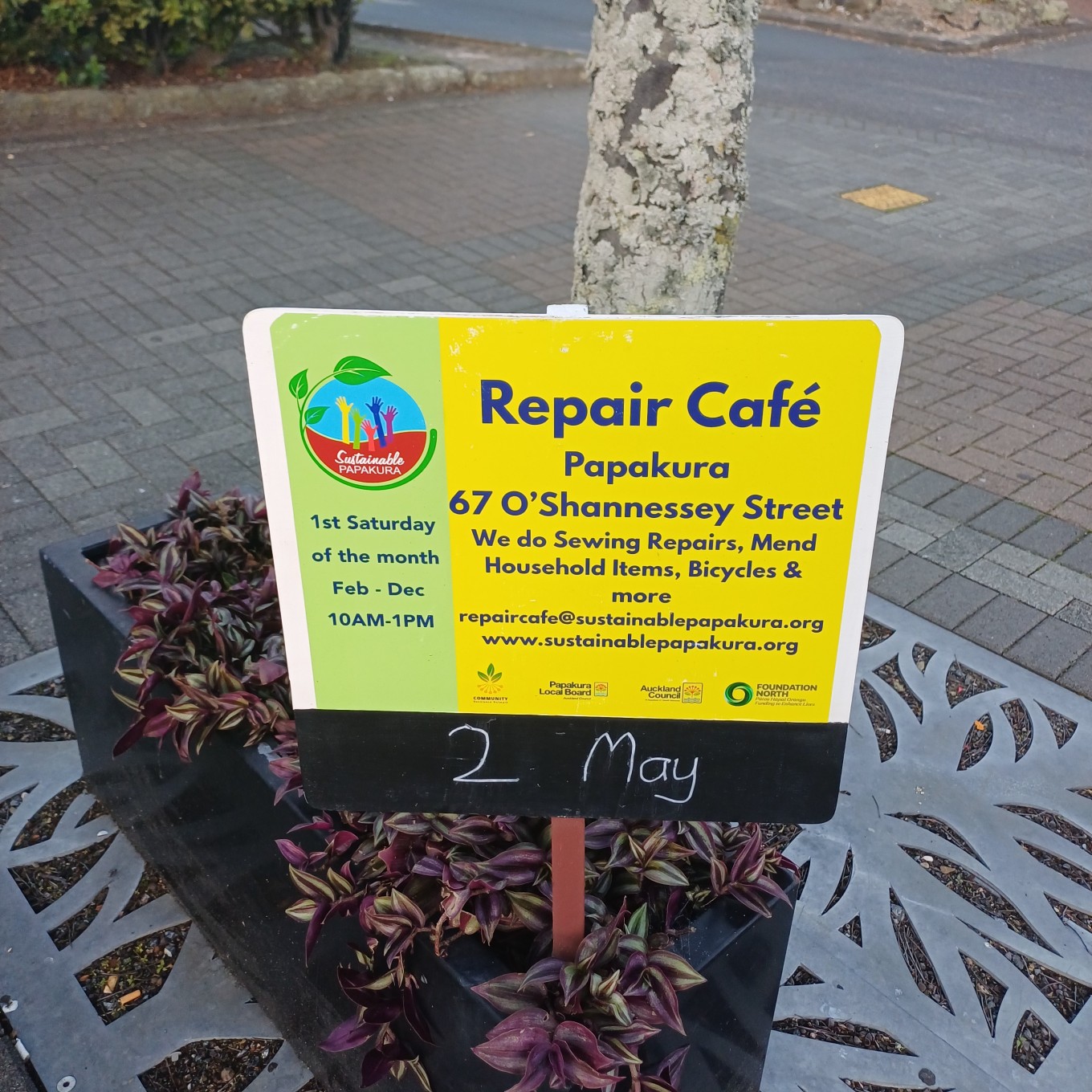 A sign for a local repair cafe.