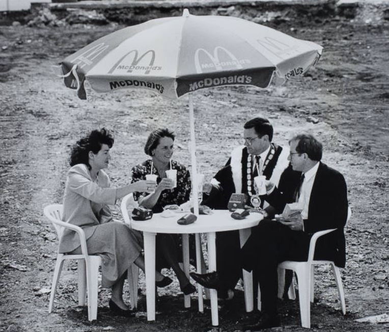 Papakura Museum staff gifted Robertson a 1993 photo showing the then MP with Papakura Mayor David Hawkins, promotions officer Christine Laurenson, and franchisee Martha Hill, on the site where the town’s original McDonald’s was to be built.