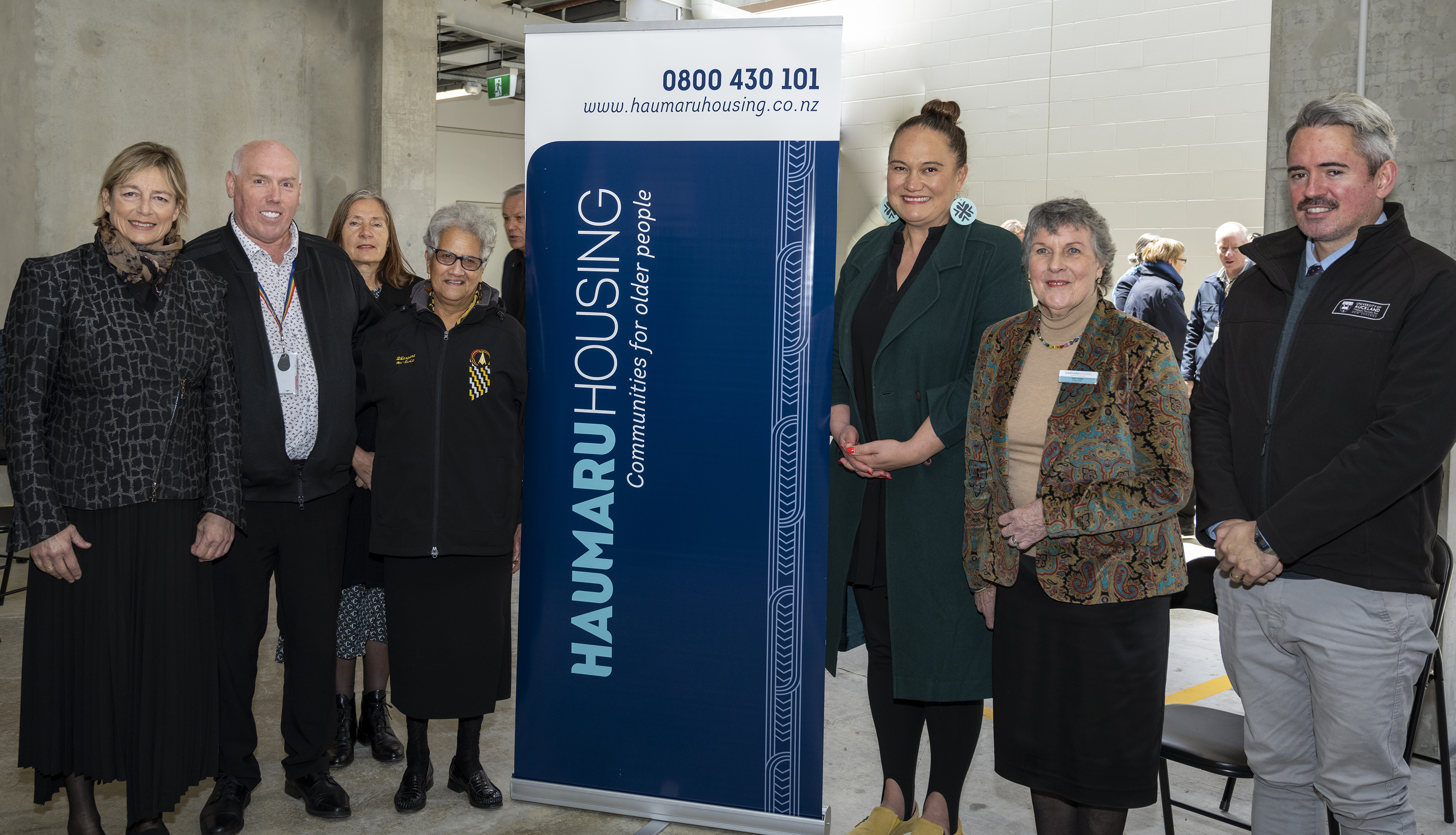 Pictured at the opening ceremony are: (from left), Haumaru Housing Board Member Dr Sue Watson, Kāinga Ora Programme Director Nick Seymour, Haumaru Housing GM Operations Gillian Schweizer, a Haumaru Housing tenant Ope Maxwell, Minister Carmel Sepuloni, Haumaru Housing Board Chair Dr Kay Hawk and Minister with the Haahi Mhingare (Maaori Anglican Church) Geremy Hema.