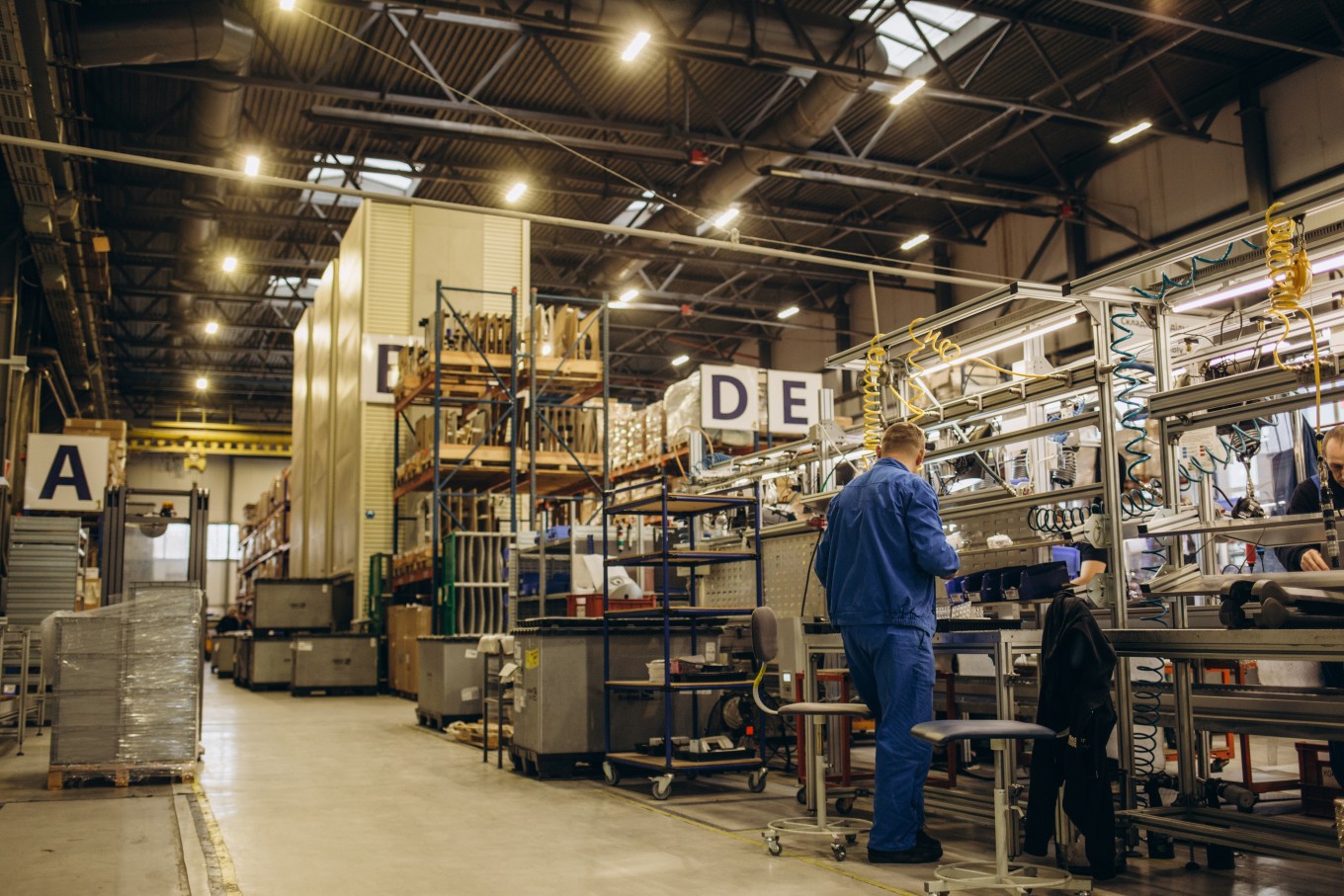 A factory worker in the middle of a workchain.