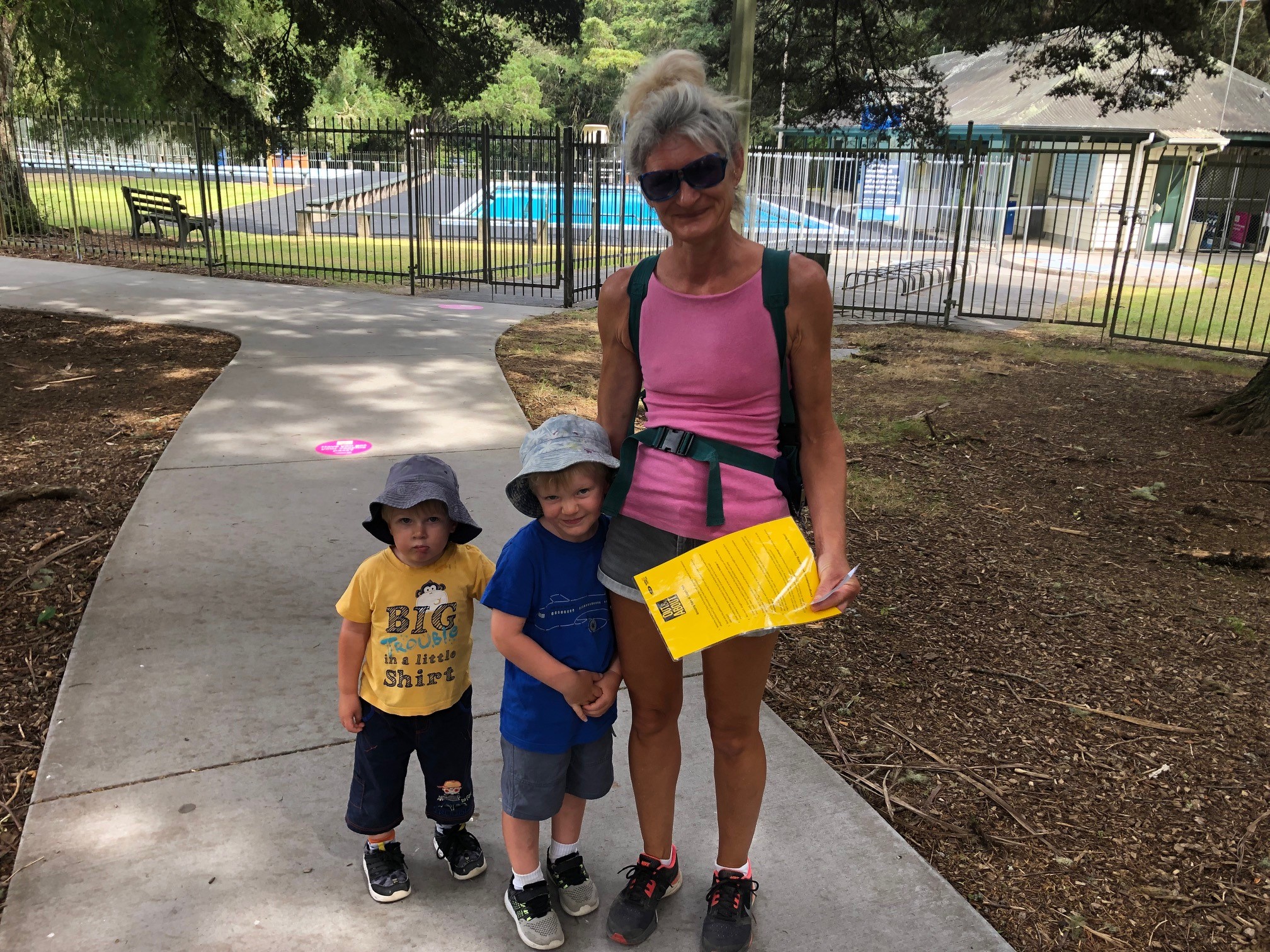 Two young children take a walk in Totara Park with their Mum.