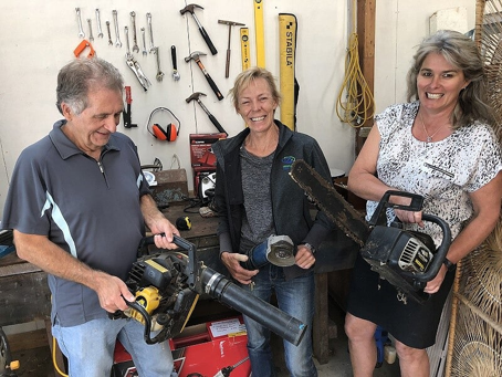 Franklin Local Board member Sharlene Druyven, right, gets to grips with the Waiuku Zero Waste Tool Library.