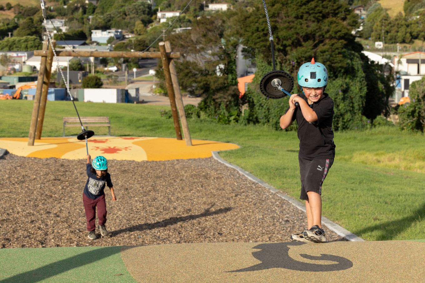 Kids riding their flying foxes at a local park. 
